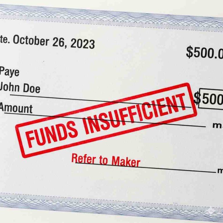 A bank cheque stamped with the words "Funds Insufficient," illustrating a cheque bounce scenario.